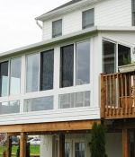 <p>Engineered for safety with glass kneewall windows that meet building codes for sunrooms on raised decks, this installation above the walk-out basement offers great views and year round comfort.</p>
