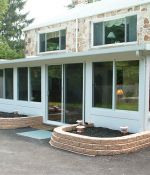 <p>This huge, beautifully landscaped sunroom is where this family&rsquo;s teenagers entertain their friends. The kids love it because they feel like it is their own space, and the parents can chaperon the party from just the right distance.</p>
