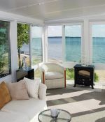 <p>This sunroom allows the homeowner to enjoy the waterfront view all year long.<br>
&nbsp;</p>
