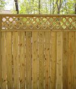 Board and Lattice Privacy Fence with Standard Posts